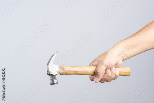Hand holding custom wooden grip hammer
