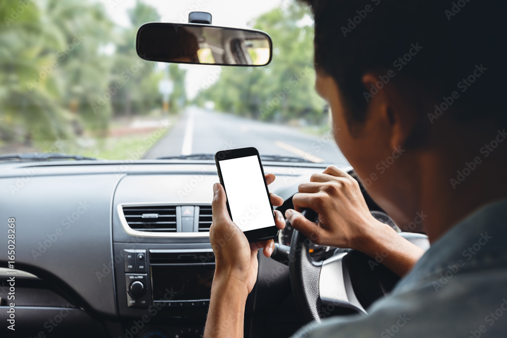 man looking at phone inside car man looking at phone inside car