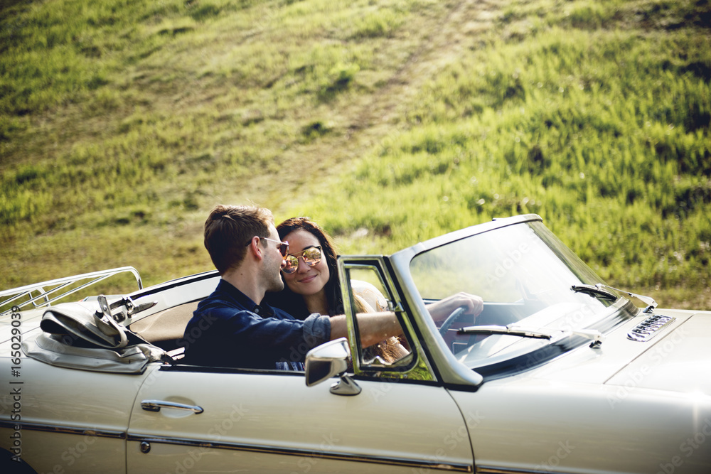 Couple Driving a Car Traveling on Road Trip Together Couple Driving a Car Traveling on Road Trip Together