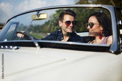 Couple Driving a Car Traveling on Road Trip Together © Rawpixel.com