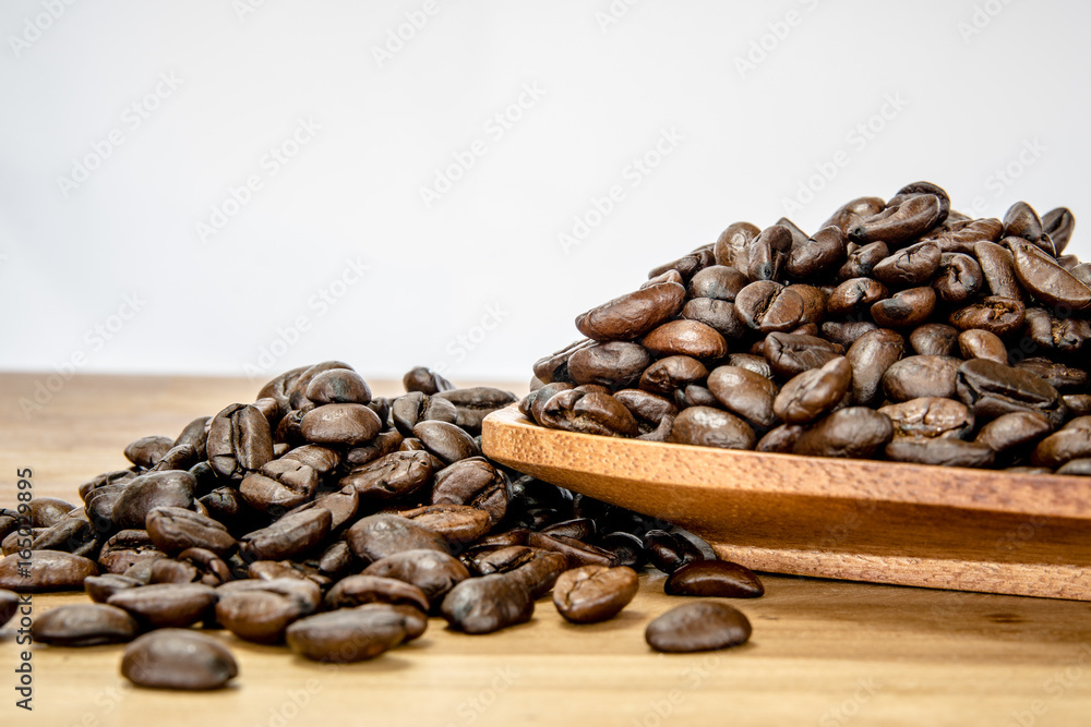 Roasted coffee beans on wooden plates