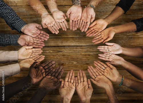 DIverse hands are together in a circle shape photo