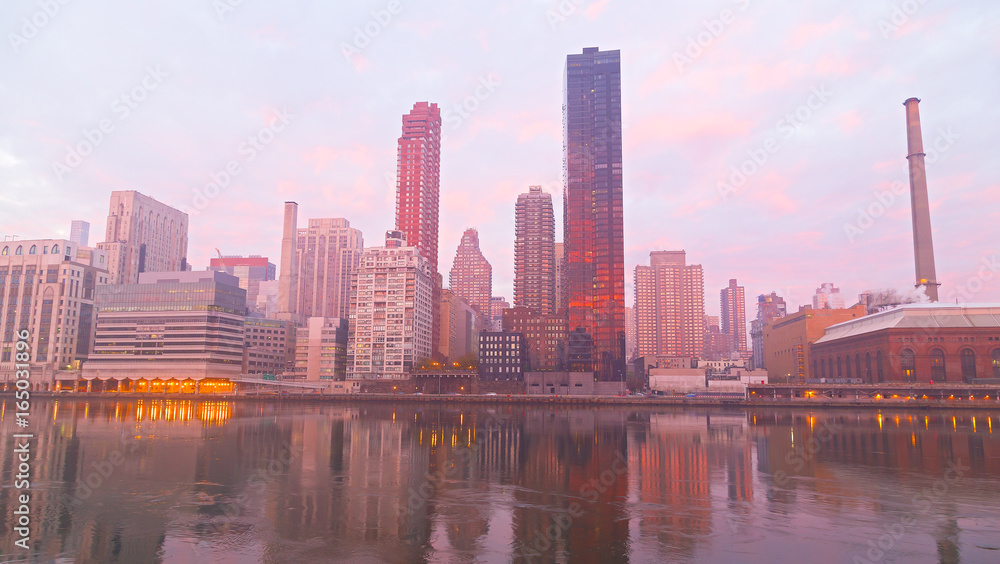 Fototapeta premium Manhattan skyline on a foggy morning, New York, USA. New York downtown near East River at dawn.