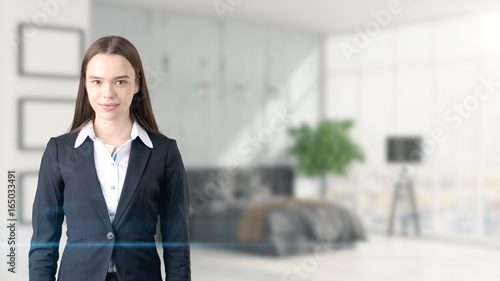 Free Download Young beautiful business woman and creative designer standing over blured interior background - GFXLoad