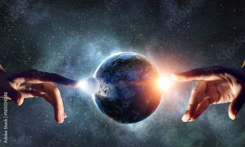 Tableau sur toile Touching planet with finger