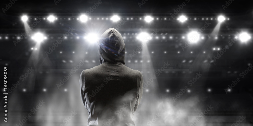 Fototapeta premium Silhouette of man in hoody