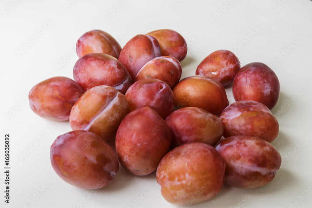 Vegan food. Fresh plum isolated on white background