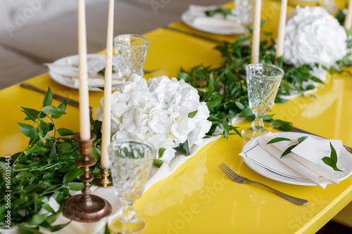 Candles and goblets on a decorated wedding table. selective focus photo