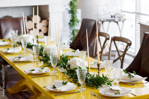 Candles and goblets on a decorated wedding table