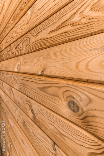 Wall of new wooden planks close-up.