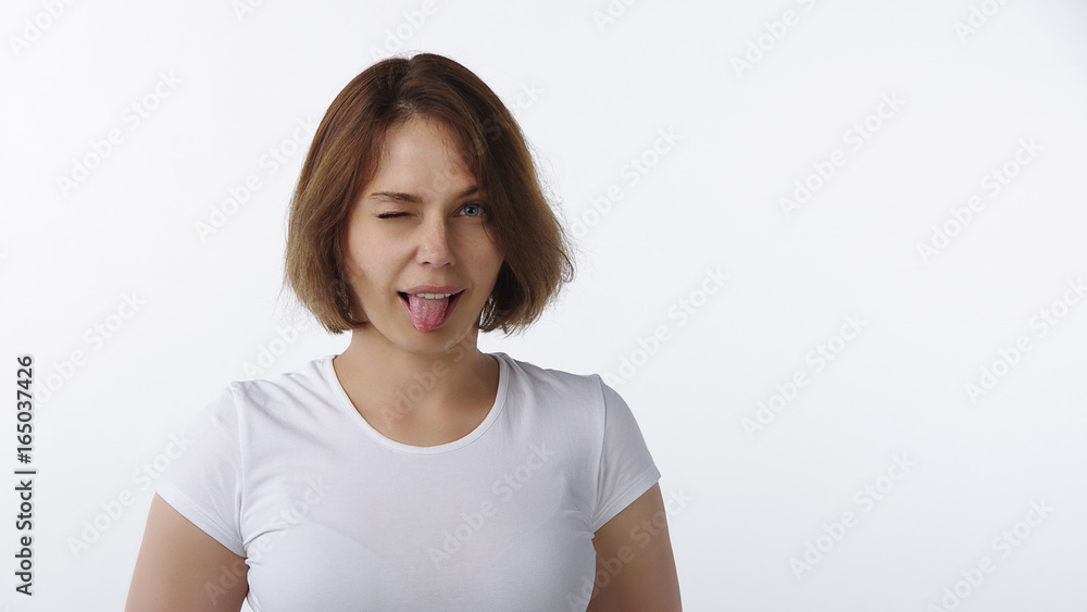 Beautiful girl puts out the tongue Beautiful girl puts out the tongue