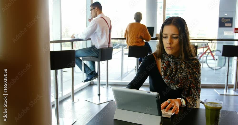 Female executive using digital tablet Female executive using digital tablet