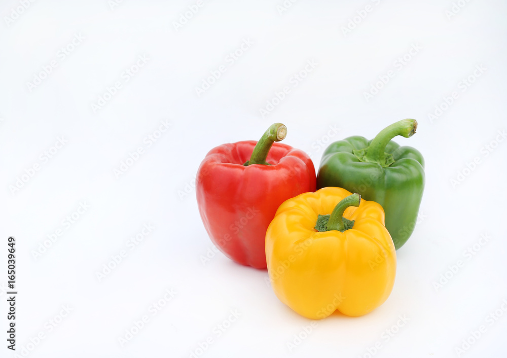 Green, red and yellow bell pepper isolated on white background. Green, red and yellow bell pepper isolated on white background.
