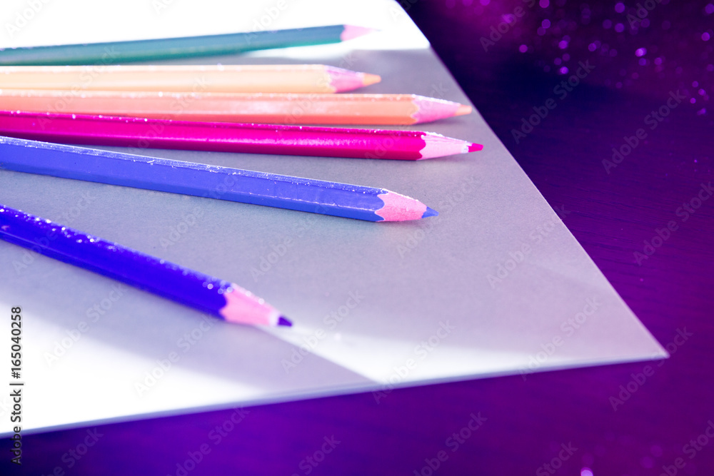 Naklejka premium Colorfully Illuminated Colored Pencils