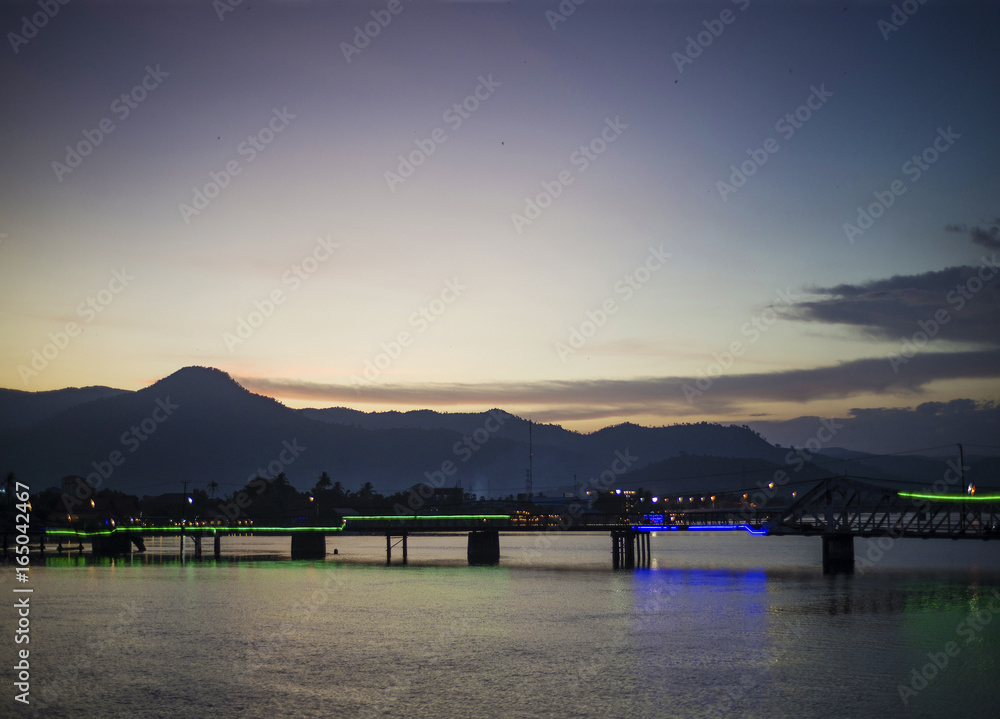 view of old bridge in kampot town cambodia at sunset