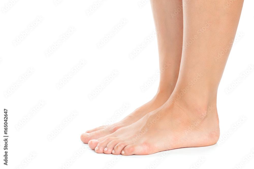Beautiful women feet isolated on white close-up Beautiful women feet isolated on white close-up