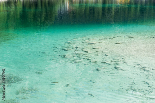 Clear turquoise water with stones in the beautiful Eibsee