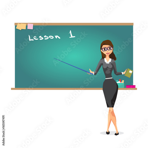 Young female teacher on lesson at blackboard in classroom. Lectu