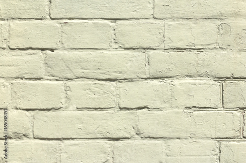 brick wall covered with yellow lime
