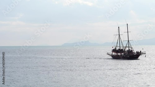 Rocky coast of mediterranean sea and boat photo