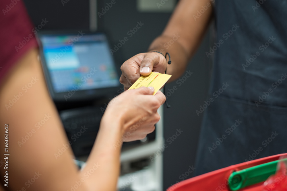 Woman paying with credit card