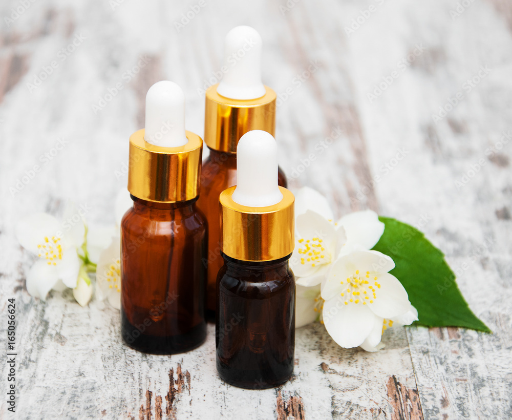 Massage oils and jasmine flowers Massage oils and jasmine flowers