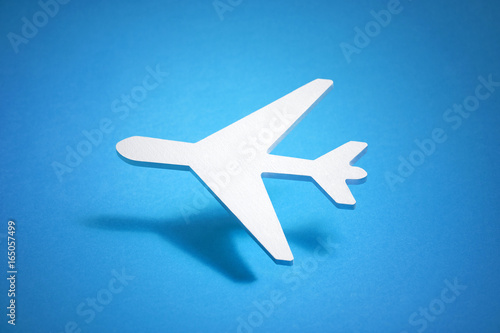Airplane shape over blue background 