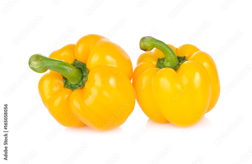 whole fresh yellow bell pepper with stem on white background whole fresh yellow bell pepper with stem on white background