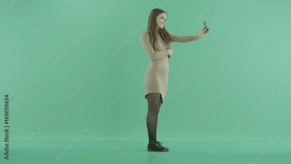 a young girl makes selfies with the phone a young girl makes selfies with the phone