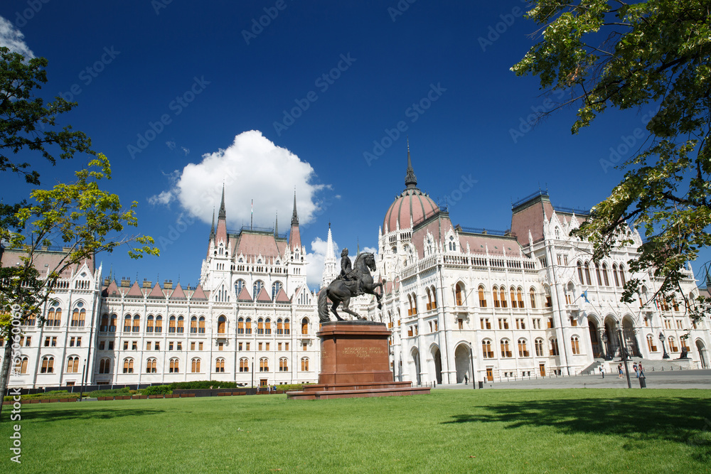 The Parliament building and the equestrian statue in the summer in Budapest