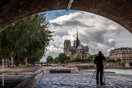A Photographer in Paris Photographing Notre Dame and the Seine