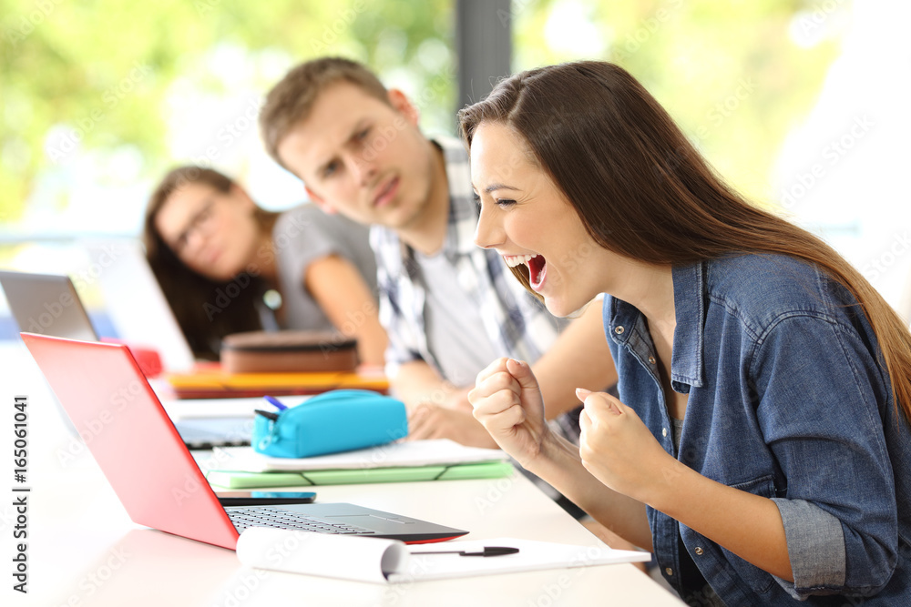 Excited student on line in a classroom Excited student on line in a classroom