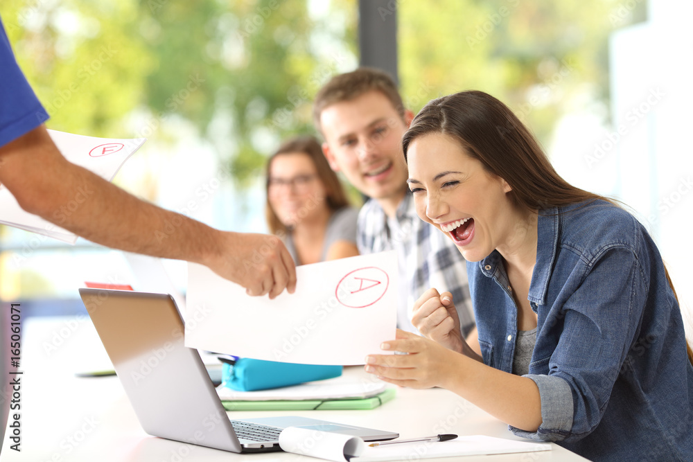 Excited student receiving an approved exam Excited student receiving an approved exam