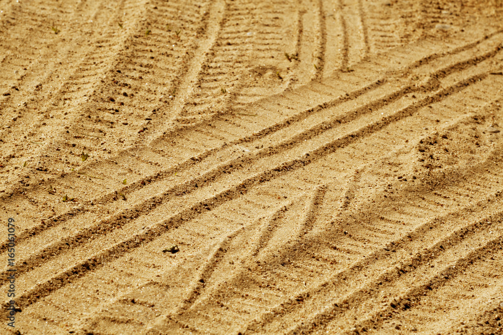 Tire imprints on sandy desert road. Tire imprints on sandy desert road.
