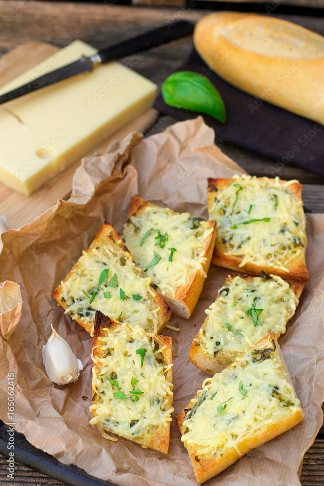 Bread baguette baked with grated cheese and garlic Bread baguette baked with grated cheese and garlic