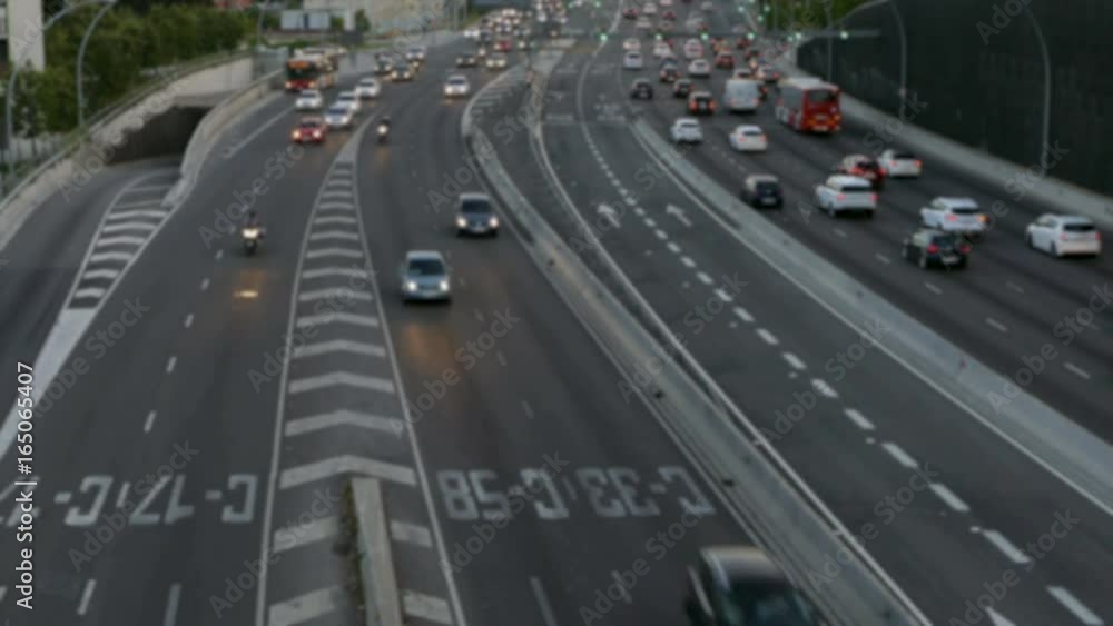 Blurred evening urban traffic scene with a top and rear view access roads to Barcelona.With
cars stopped and then set in motion.Time Lapse. Blurred evening urban traffic scene with a top and rear view access roads to Barcelona.With
cars stopped and then set in motion.Time Lapse.