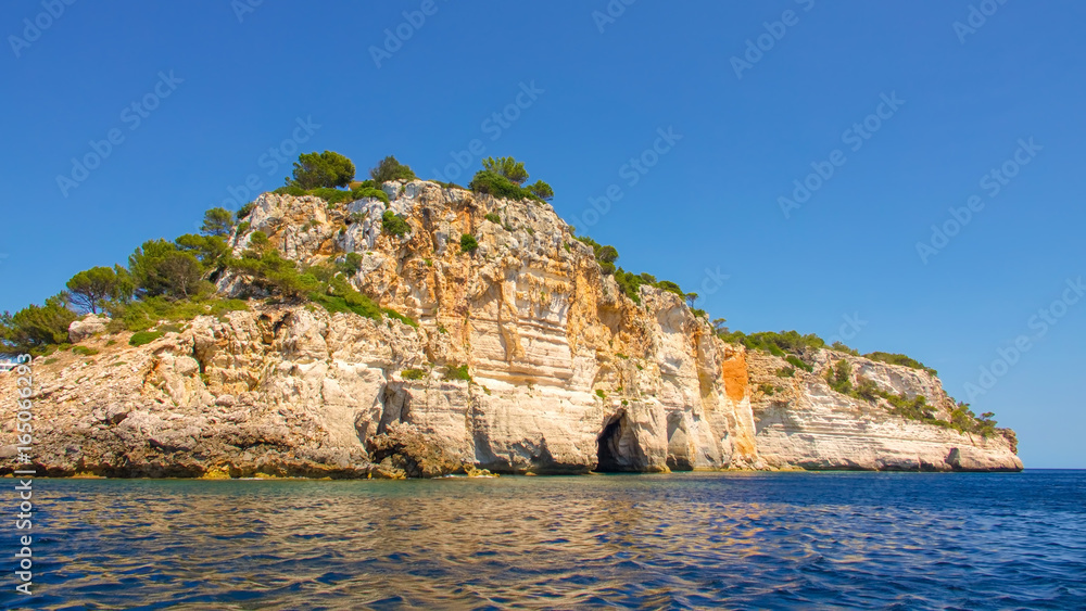 Coastal scene from a boat off the south coast of Menorca in Spain
