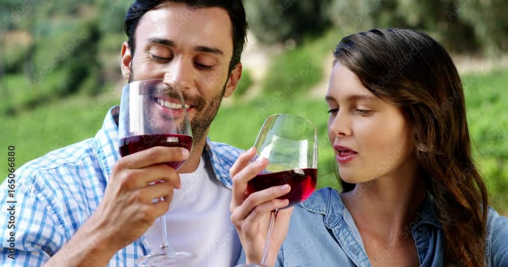 Couple having wine in the farm Couple having wine in the farm
