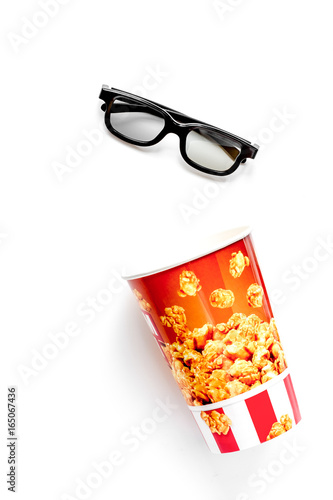 concept of watching movies with popcorn top view white backgroun