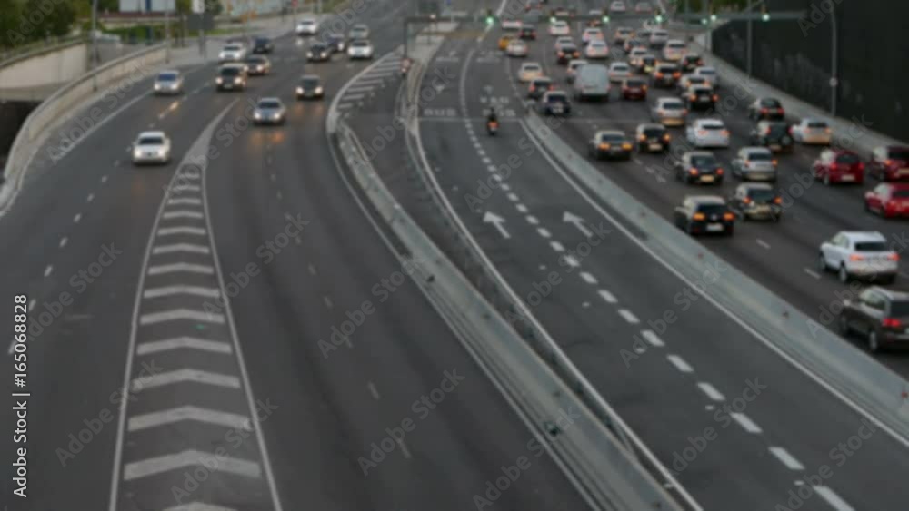 Blurred evening urban traffic scene with a top and rear view access roads to Barcelona.The
cars stop and then circulate.Time Lapse. Blurred evening urban traffic scene with a top and rear view access roads to Barcelona.The
cars stop and then circulate.Time Lapse.