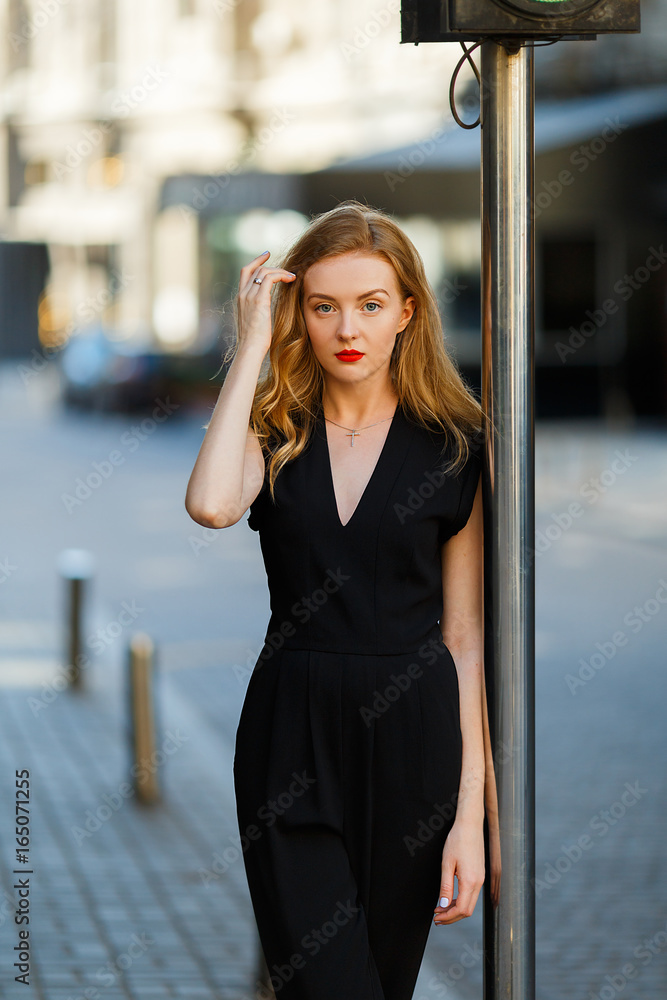 Model in black stylish suit and with red lipstick Model in black stylish suit and with red lipstick