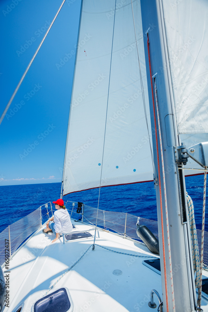 Fototapeta premium Woman Sailing On Yacht in Greece