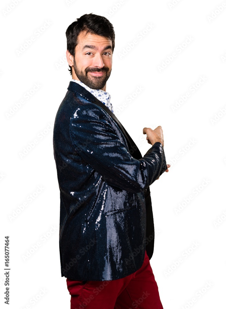 Man with jacket pointing back Man with jacket pointing back