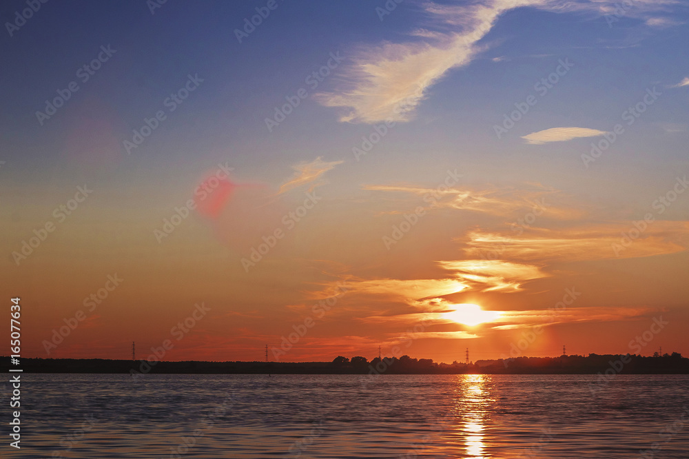 Obraz premium The sun set over Lake Liepāja