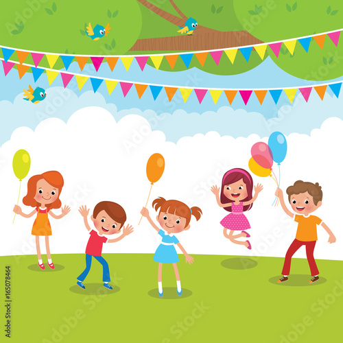 Group of children playing with balloons and having fun outdoors