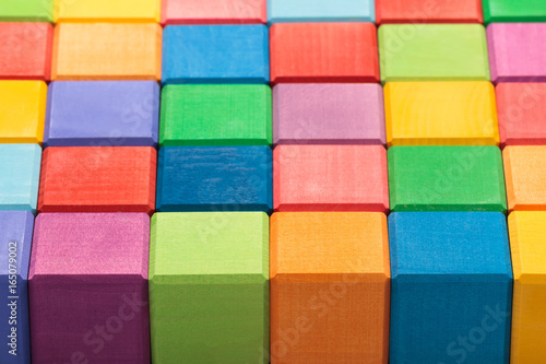 Colorful wooden bricks background. Colorful wooden texture. Shallow DOF