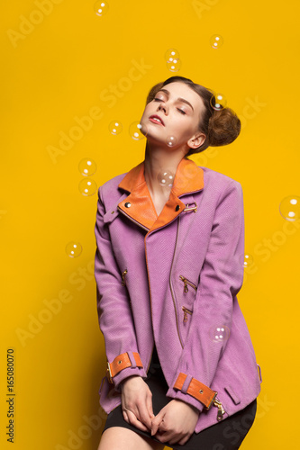 Yong lady in stylish jacket posing © kegfire