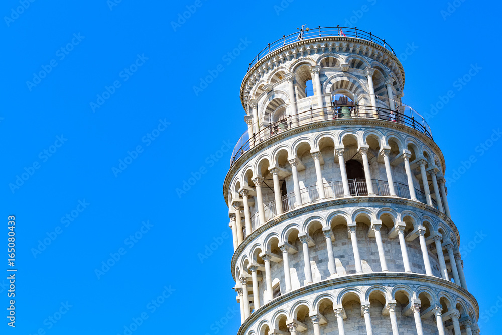 Leaning tower of Pisa, Italy against a cloudless blue sky