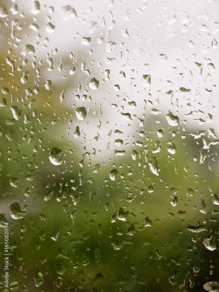 rain drops on glass door to garden