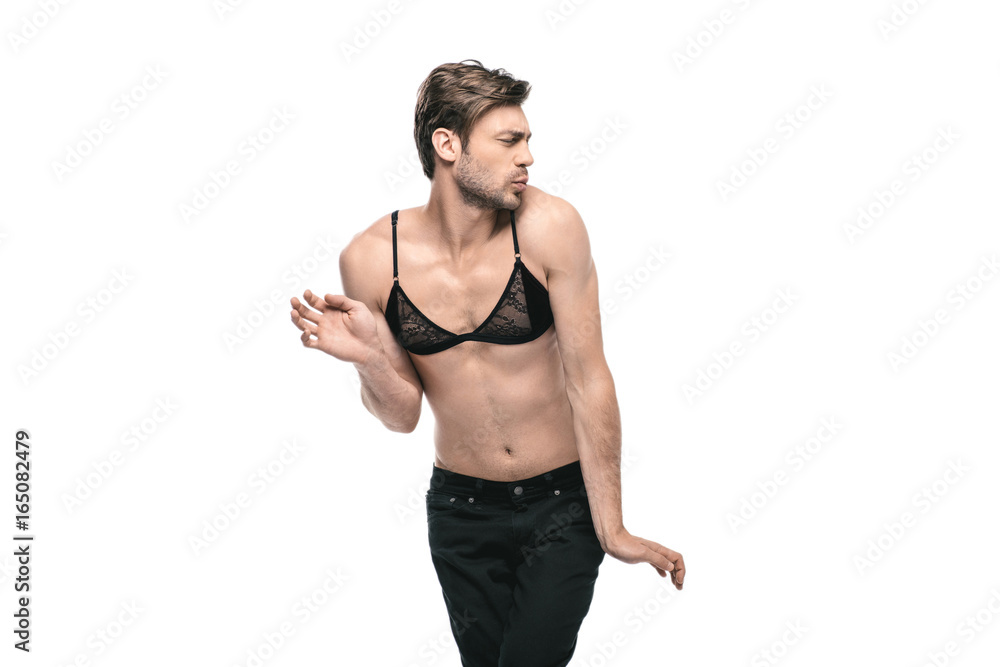 young handsome homosexual man wearing womens bra, isolated on